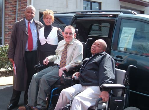 Group shot in front of new van